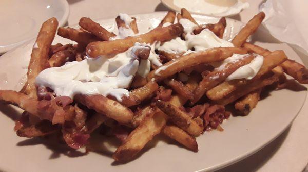 Queso fries with lots of sour cream