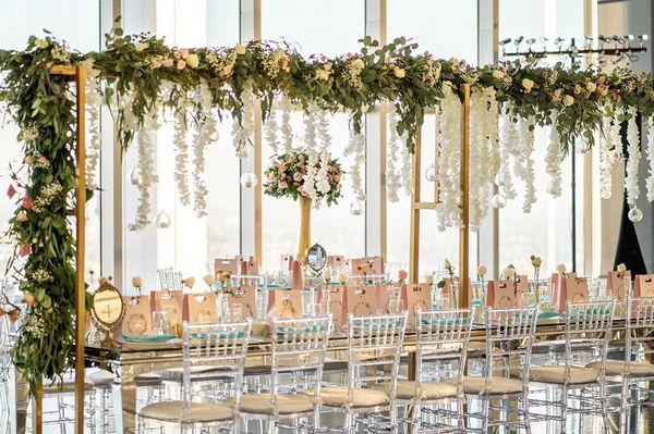 Custom made gold arches for long tables with our flowers