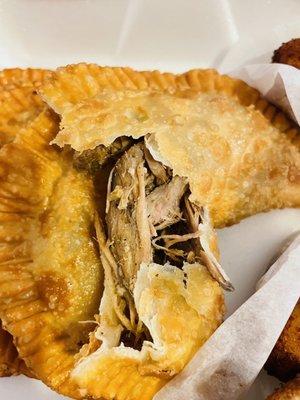 Inside the lechon empanada (hint of sweet in the crust-idk if this intentional). The meat is perfectly moist.