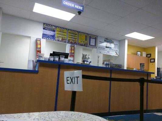 The ice cream counter is clean and well-staffed.