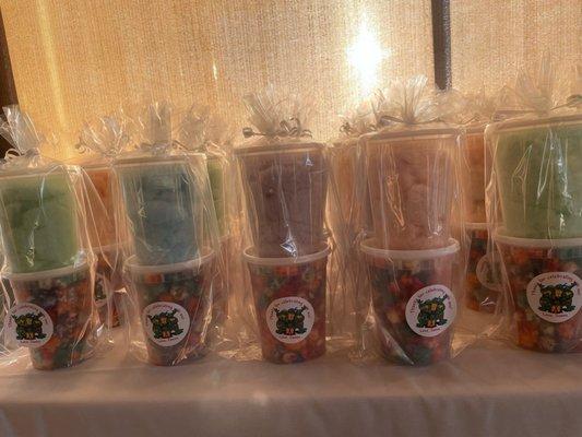 Candy popcorn + cotton candy party favors.