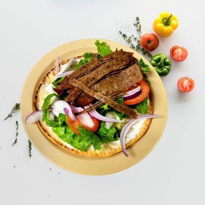 Gyro, pita bread,  Lettuce, tomatoes, onions, lamb meat and tzatziki sauce