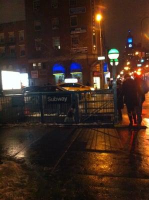 The entrance of the subway by night.