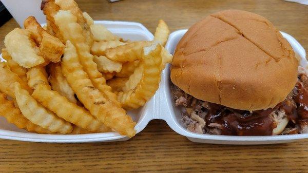 BBQ pork sandwich with crinkle cut fries