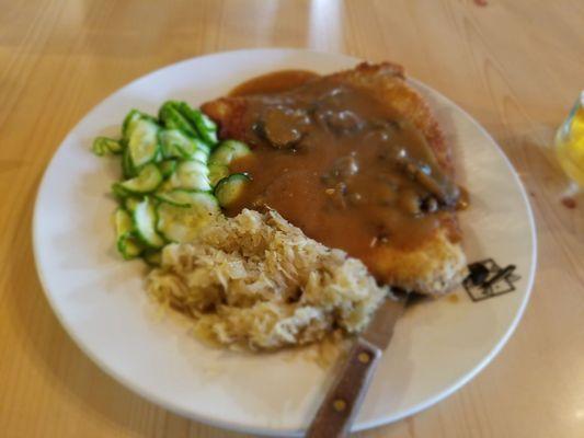 Schnitzel w/cucumber salad and sauer kraut