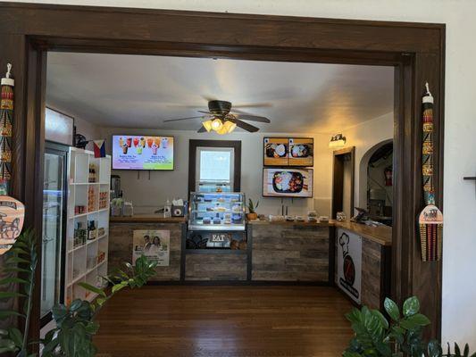 Cashier area with shelves of snacks for sale