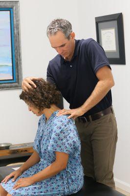 Myofascial Release of the Levator Scapulae during a routine chiropractic visit performed by chiropractor.