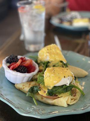 California California Crepes Benedict - perfectly cooked with a side if berries on whip cream