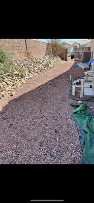 Before dog feces removal, light organization and leveling out gravel