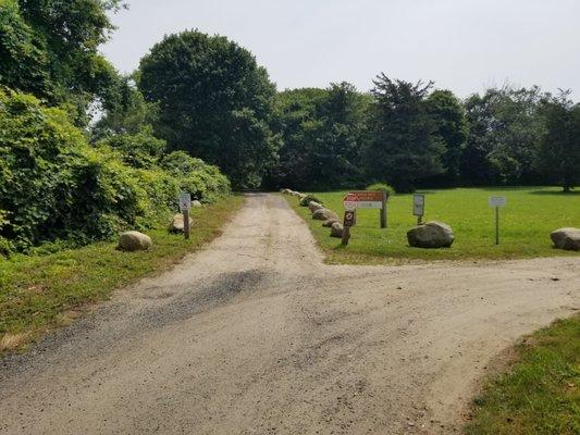 Straight ahead is a private driveway and access to the trail. Park to the right and walk in.