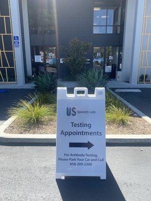 Once you drive into the parking lot you will see signs that designate you to the back of the building for testing,