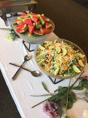 Taco salad and sliced watermelon