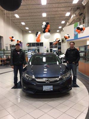 Me and my dad standing next to my brand new car