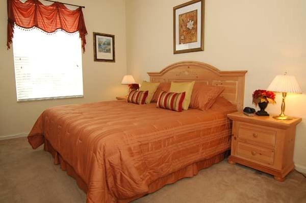 Master bedroom with king bed, TV, walk in closet and bathroom.