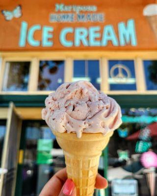 Strawberry ice cream on a cake cone