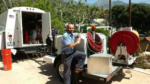 Harry From Bobby Blue Plumbing Rancho Cucamonga next to Hydro Jetting Machine in Upland Californa