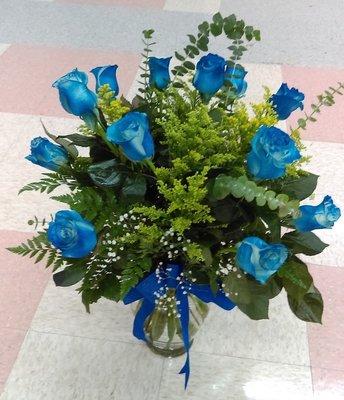 Blue roses.
Beautiful blue roses in a crystal vase.