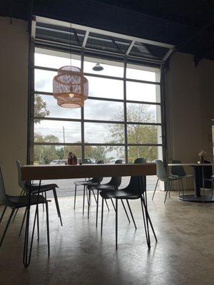 Seating and garage door open for fresh air