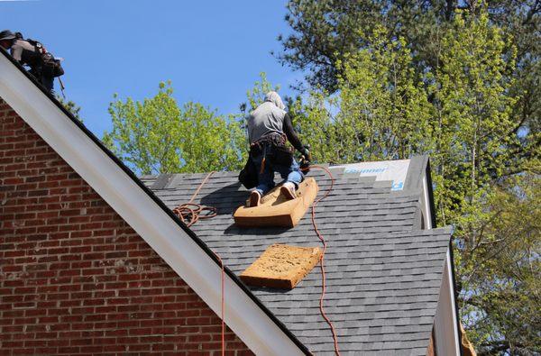 Certified in-house roofing crew installs shingles with the five-course pattern according to manufacturer guidelines