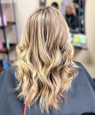 Highlights and lowlights  for this client to add dimension.  She came in with previous color and grown out roots.  Hair by Honey.