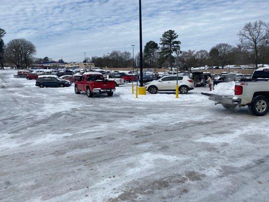 The parking lot is a sheet of ice