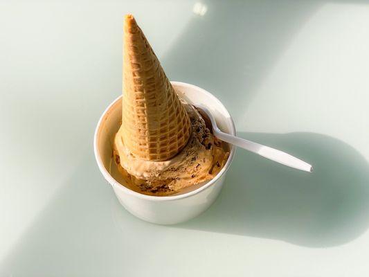 Single scoop of "Cafe Touba" ice cream flavor: Senegalese coffee ice cream, pepper brownie, & peanut brittle. $4.50 + tax + tip