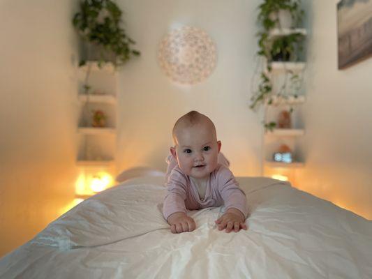 Miss Zia Castano 8 months in the newly designed massage room. She loves baby massage with our unique young living baby oil.