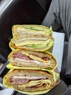 Top is an egg cheese and avocado. Bottom is bacon sausage ham and cheese. Both on a croissant.