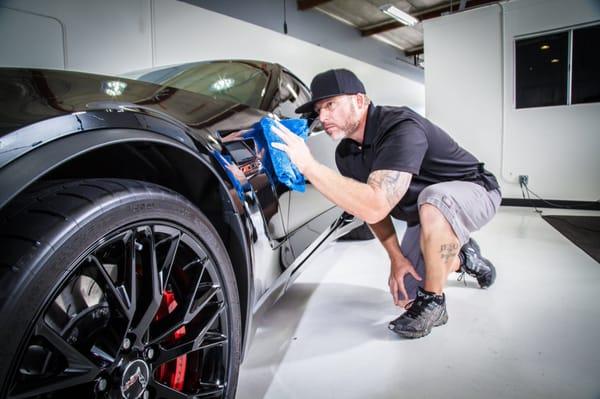 Jeremy giving this beautiful supercharged Z06 a final wipe down.