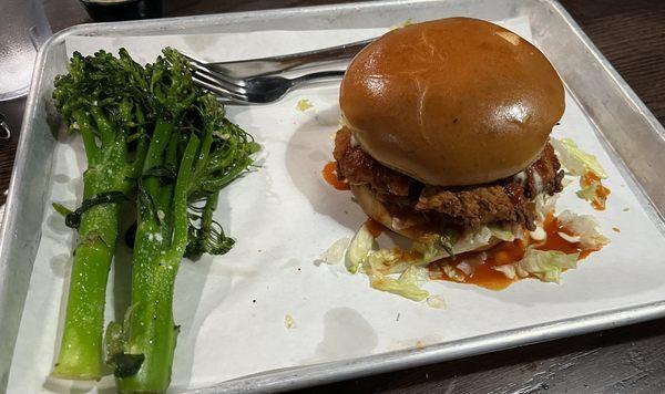 Buttermilk fried chicken sandwich with sweet pickles and buffalo sauce. Delish!