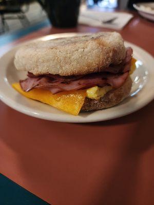 Ham breakfast sandwich on English muffin.