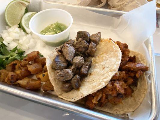 Carne asada and al pastor taco