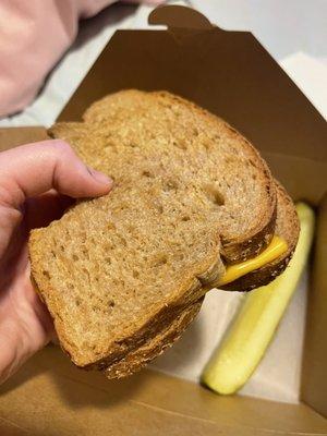 Two pieces of bread with a piece of cheese that they put in the microwave and sent it to me as a grilled cheese.