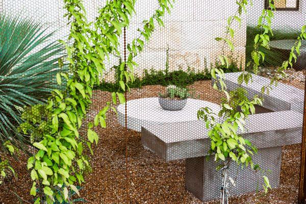 Pea gravel seating area with custom steel screen