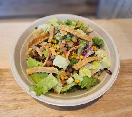 Grilled chicken bowl with Saffron Basmati rice base, lettuce, and everything else you see in the pic. Greek vinaigrette on the side.