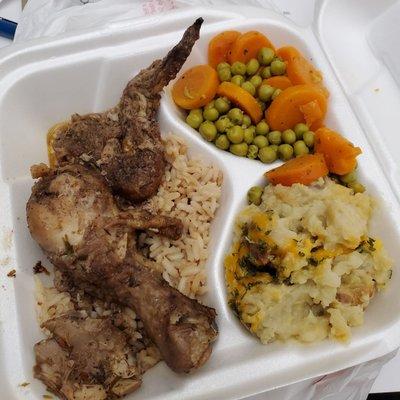 Plate lunch. Jerk Chicken over rice, mashed potatoes and peas.