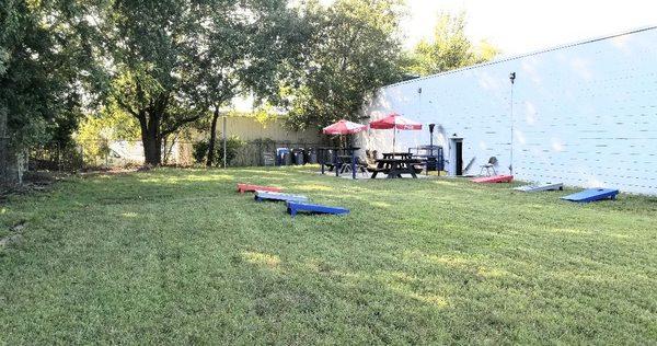 Cornhole and horseshoes are available to play in the side yard with outdoor seatings.