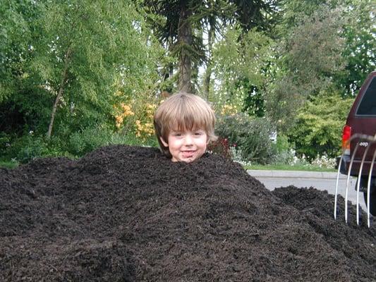 My son playing in clean Cedar Grove Compost at the Good Shepherd Center