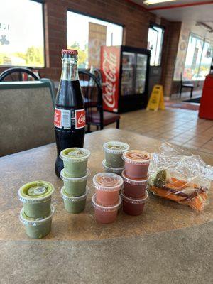 They have self serve hot sauce and pickled veggies. Two different green sauces and two different red sauces. The dark red is VERY hot!