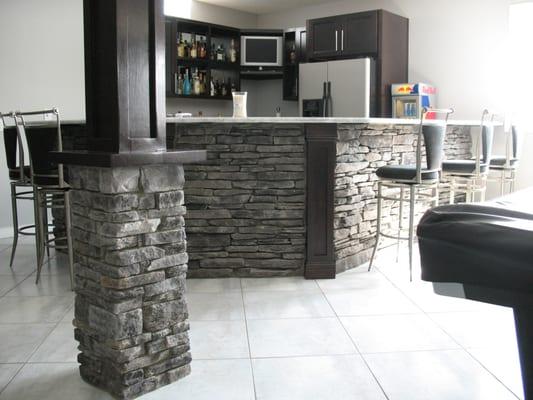 Basement bar and stone columns done inGrey Southern Ledgestone by Boral Cultured Stone