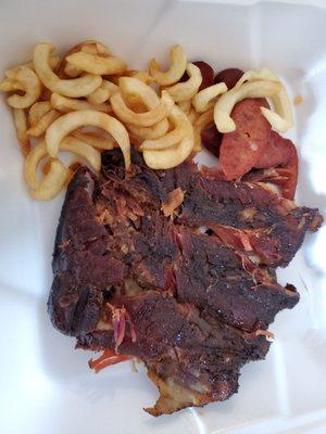 Ribs, hot links, and curly fries. This photo does not do the food justice.