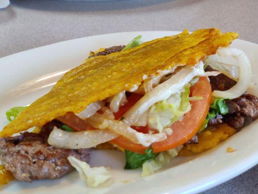 One fine Jibarito (Tostones instead of bread, steak, cheese, mayo, lettuce and tomato)