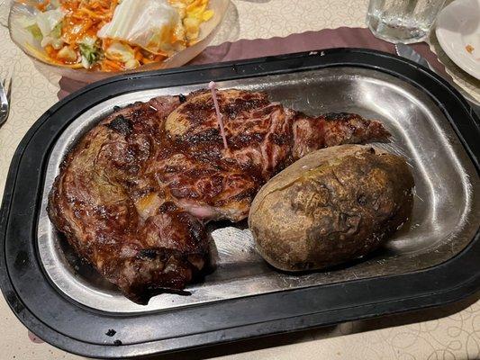 Rib eye and baked potato