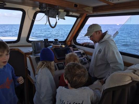 Captain Billy Pipkin showing the kids the ropes