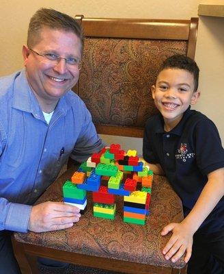 Darian and Dr. Mike enjoy the "Castle of Friends" at the Summit office.