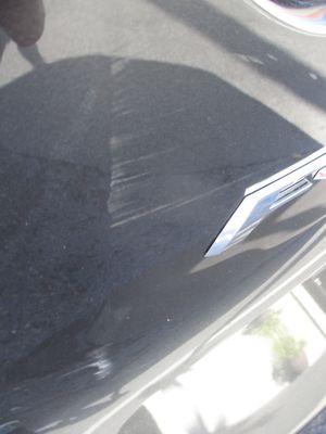 (Before) scuffed back- like something rubbed up against the car