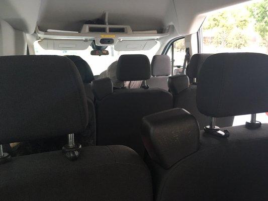 This is the small van interior. Imagine paying for a big bus seat and now stuck in here for 7 hours. What a scam.