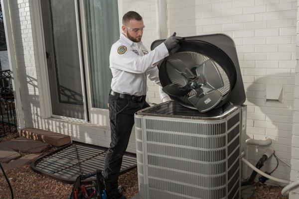 Rob repairing an AC.