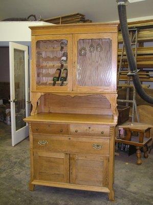 China Hutch- Repaired, refinished. Top modified to hold wine bottles and glasses.