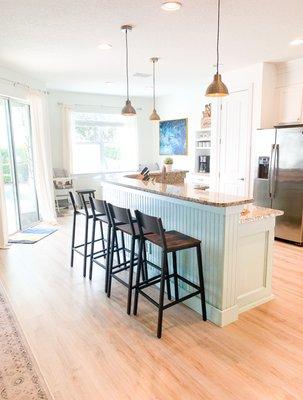 Love his placement & height of these kitchen bar lights.